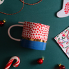 Festive Red Polka Dot Ceramic Coffee Mug with Blue and Gold Accents