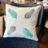 Embroidered Linen Cushion with Leaf Motif and Green Trim