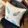 Embroidered Linen Cushion with Leaf Motif and Green Trim