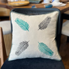 Embroidered Linen Cushion with Leaf Motif and Green Trim