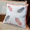 Embroidered Linen Cushion with Leaf Motif and Orange Trim