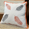 Embroidered Linen Cushion with Leaf Motif and Orange Trim