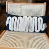 Black Linen Cushion with White Braided Knitted Detail